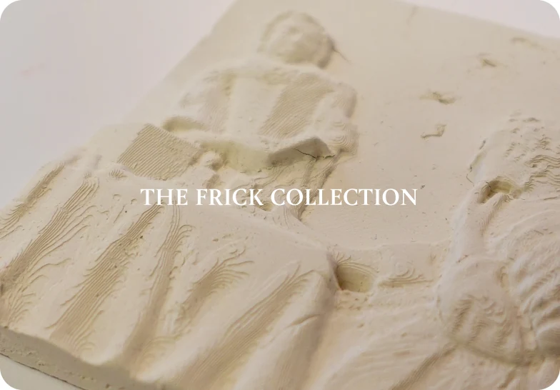 A pale relief cast of a Vermeer painting made as a touch object, captioned “The Frick Collection”.